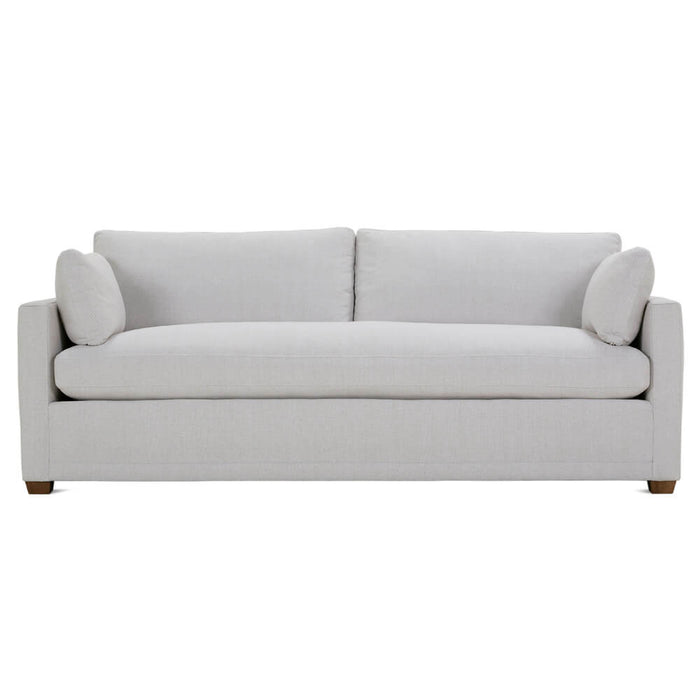 Front of white upholstered two cushion sofa with brown legs.