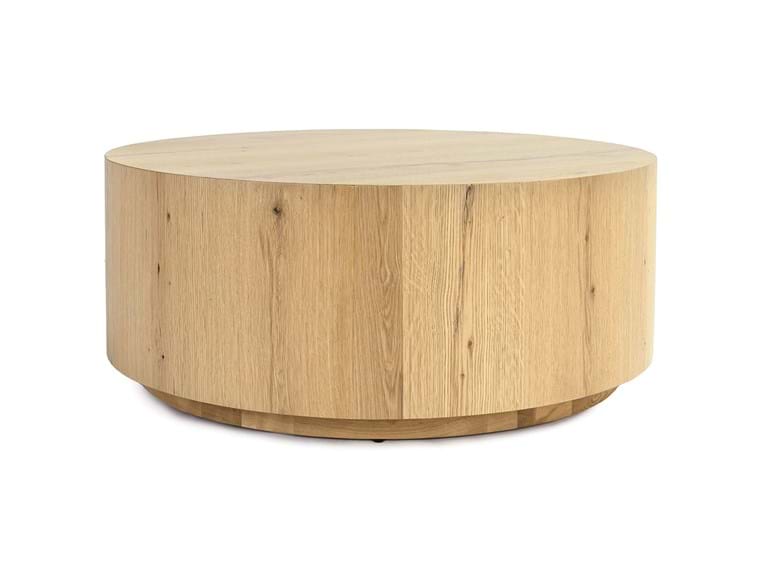 Close up of light brown round coffee table.