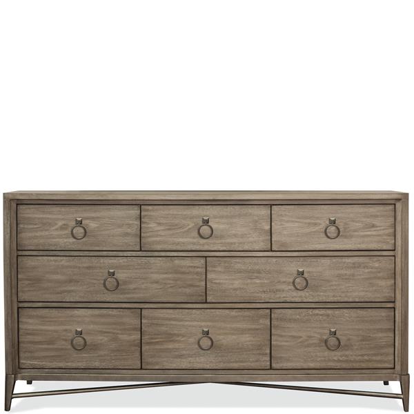 Front of light brown eight drawer dresser with round pulls.