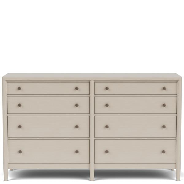Front of cream colored eight drawer dresser with copper pulls.