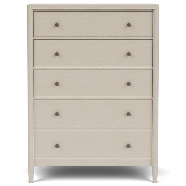 Front of cream five drawer dresser with round copper pulls.