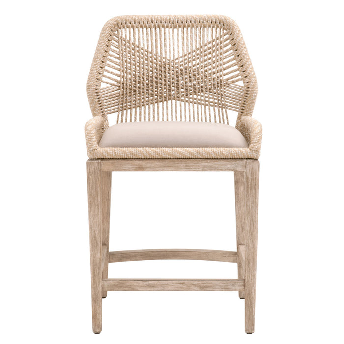 Sand colored loom counter stool with cream cushion.
