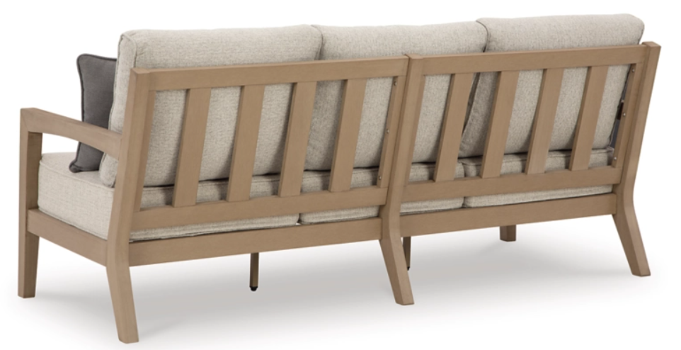 Back of patio bench with back slats and cream cushions.