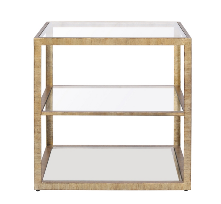 Gold side table with three glass shelves.