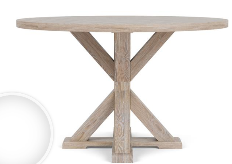 Round light wood dining table with cross bottom base.