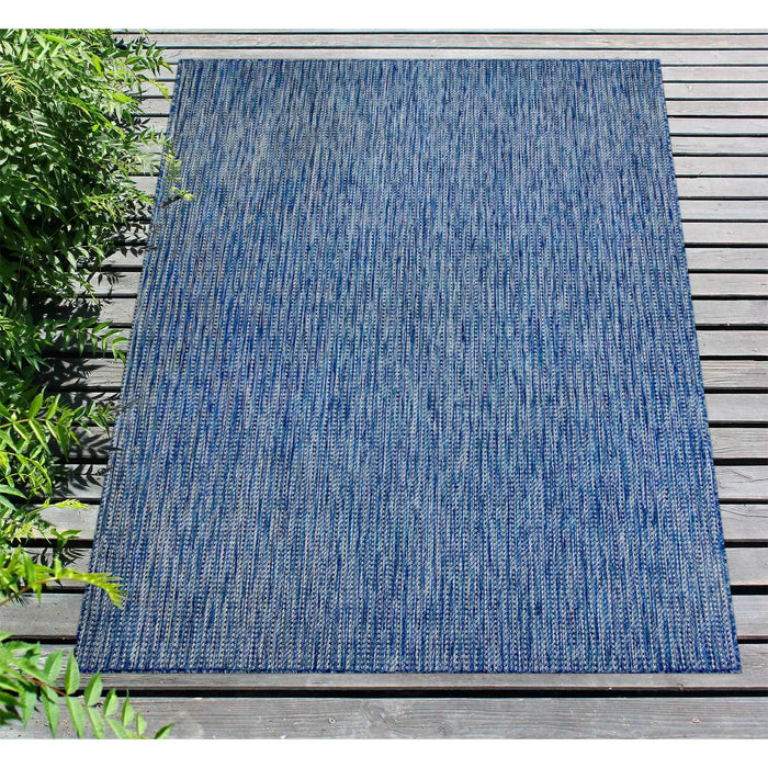 Close up of multi-color blue rug.