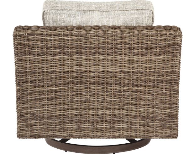 Back of brown spinning wicker chair.