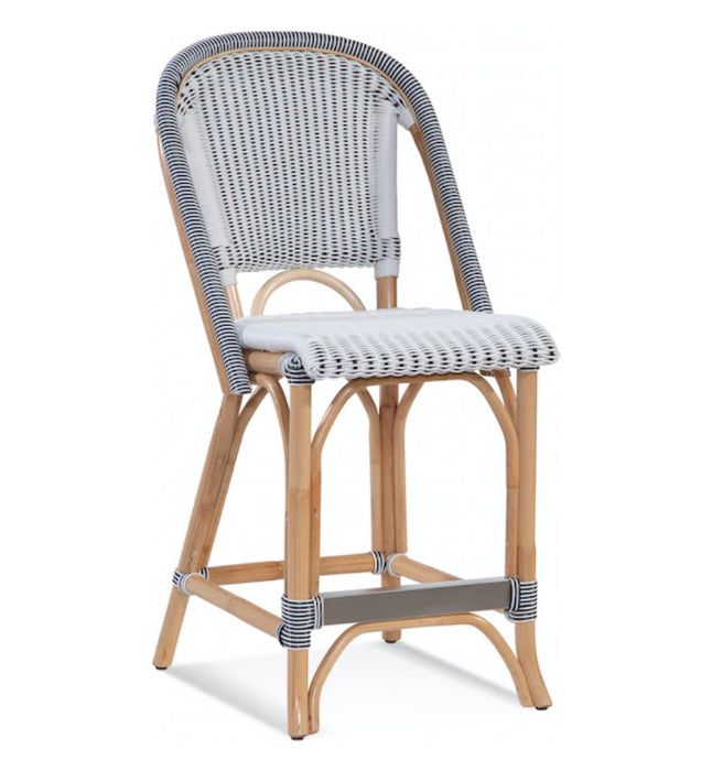 Light brown barstool with white and blue woven back and cushion.