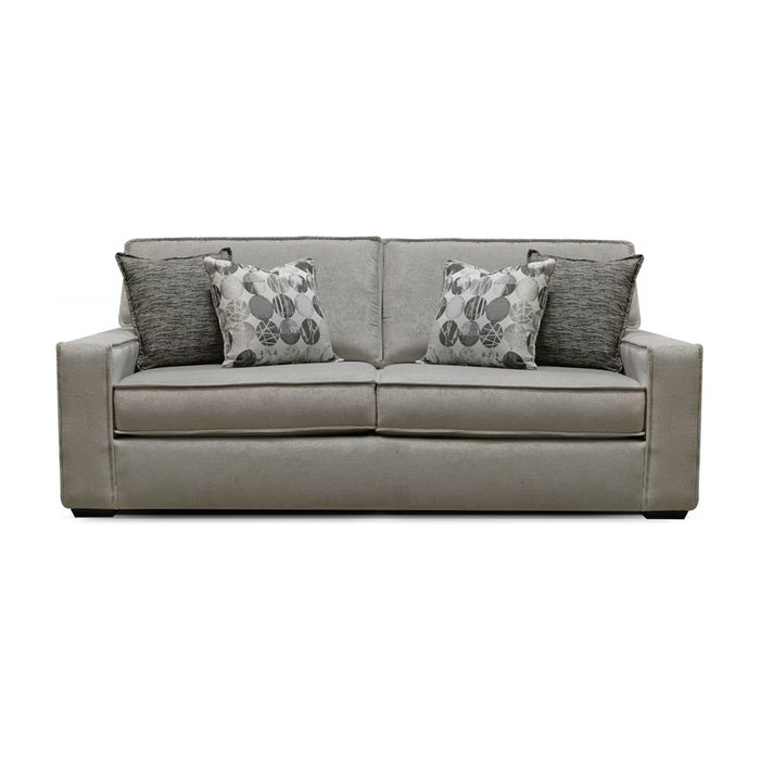 Front of medium gray two seat sofa with white and gray pillows.