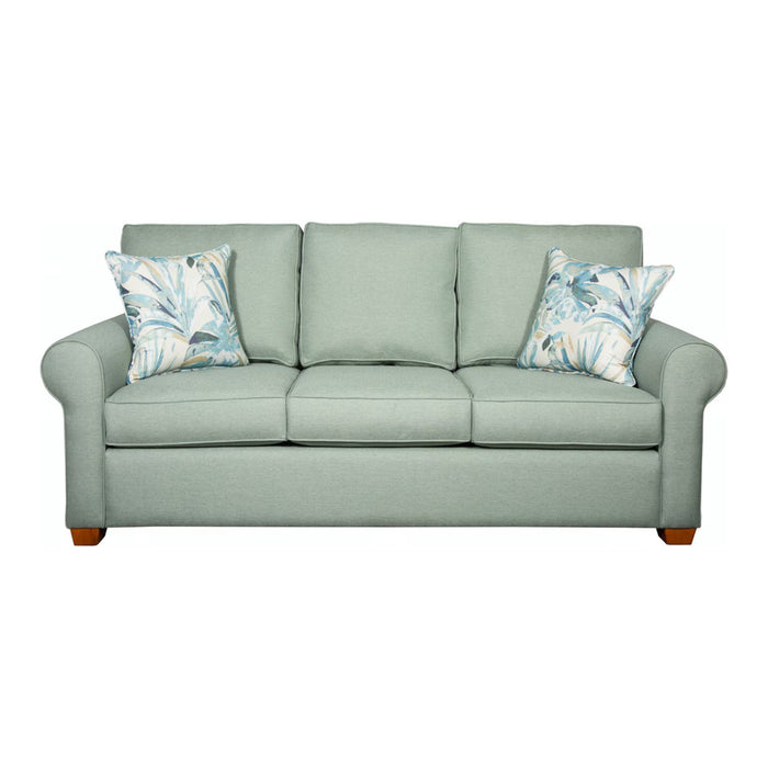 Front of sage green three cushion sofa.