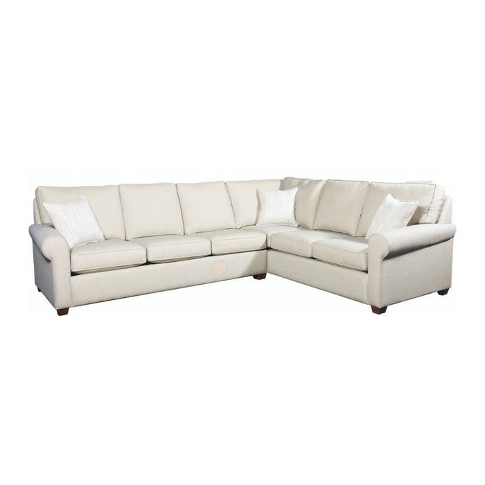 Front angled view of cream leather sectional with white pillows.