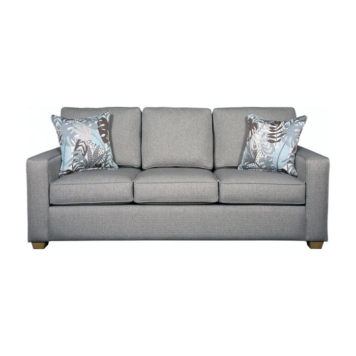 Front of gray blue three seat sofa with blue and brown pillows.
