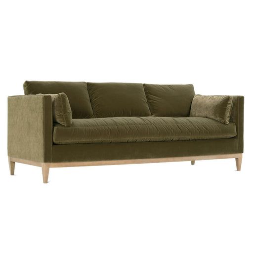 Angled view of brown velvet sofa.