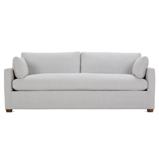 Front of white upholstered two cushion sofa with brown legs.