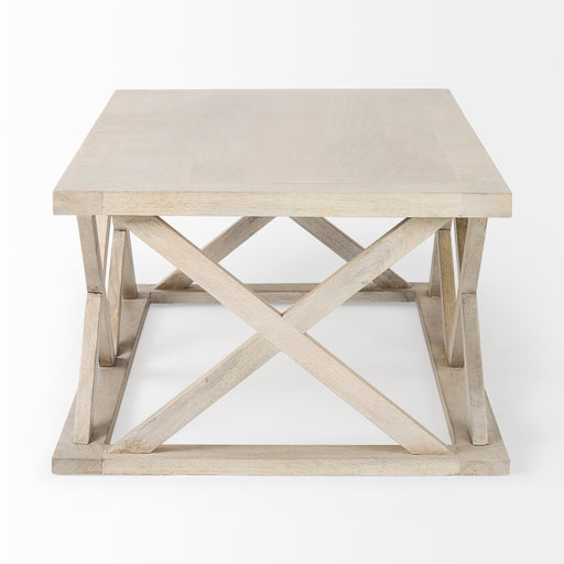 Square cream-colored coffee table with X detail on sides.