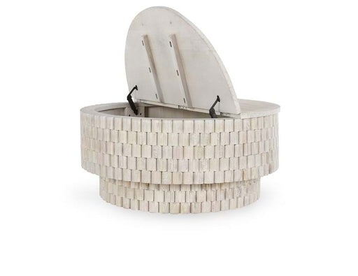 Small cream-colored round coffee table with open top.