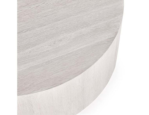 Close up of edge of white round coffee table.