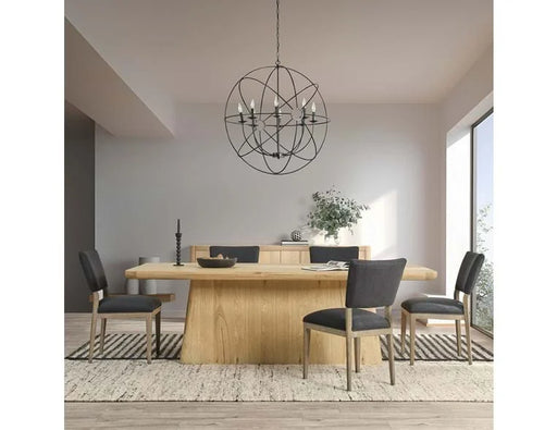 Cream dining room with wood floors, rug, and rectangular dining table.