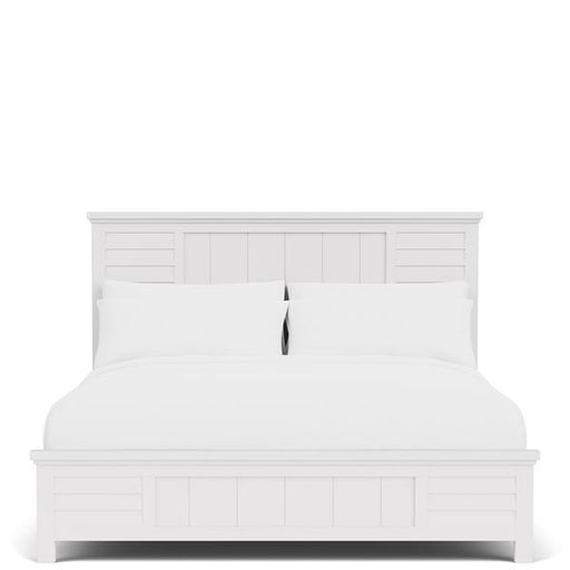All white bedroom with white bed frame and bedding.