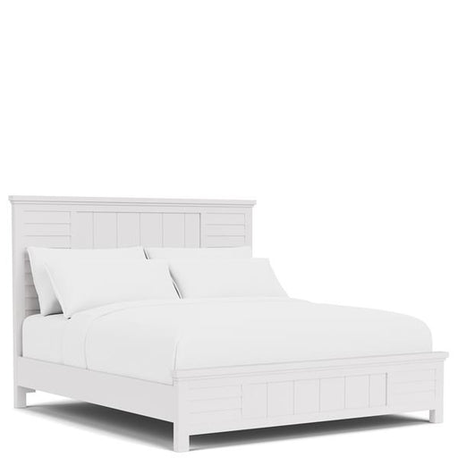 Diagonal white wooden bed frame with white bedding.