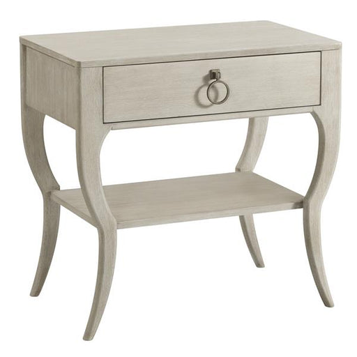 Close up of cream nightstand with drawer.