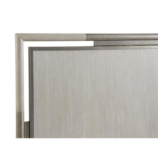 Up close of corner of white and gray headboard.
