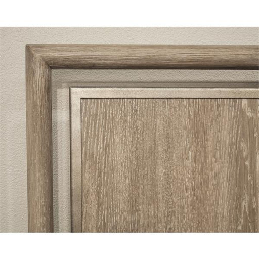 Corner of rustic brown headboard.