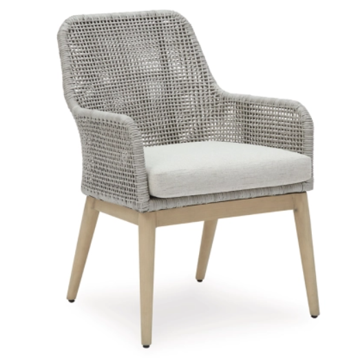 Angled gray woven chair with cream cushion.