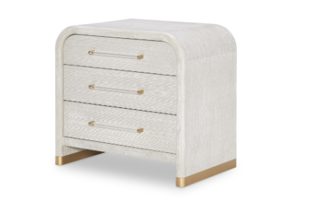 Rounded cream and gold nightstand with three drawers.