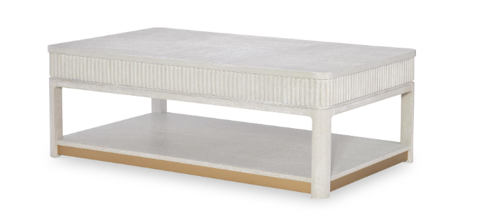 Low rectangular cream colored coffee table.