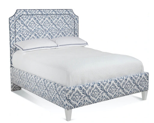 White and navy blue bed frame with carved headboard.