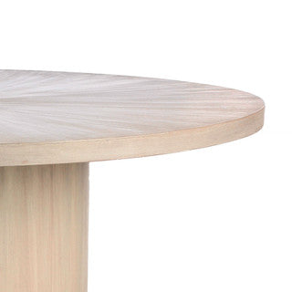 Close up of cream-colored round table.