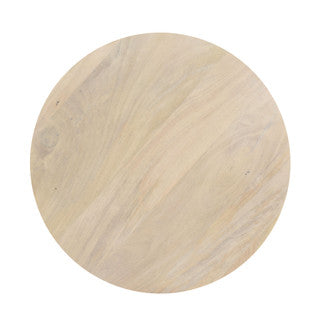 Aerial view of sand-colored round table top.