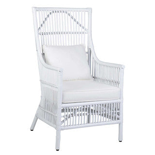 Angled white patio chair with white cushion.