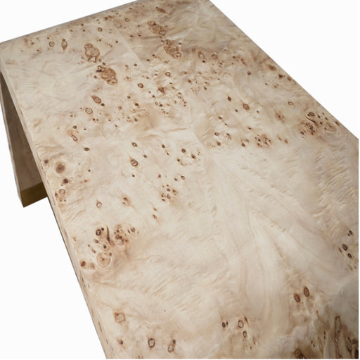 Top of cream-colored arch style coffee table.
