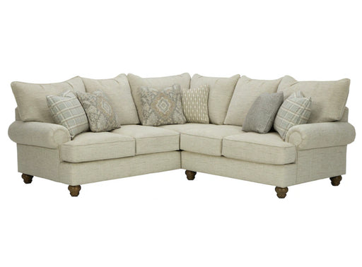 Front angled view of beige sectional with beige pillows.