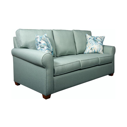 Angled view of green three seat sofa with blue and white pillows.