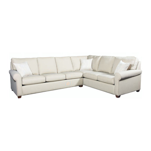 Front angled view of cream leather sectional with white pillows.