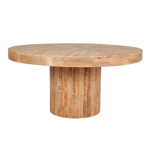 Large round light brown dining table with cork bottom.