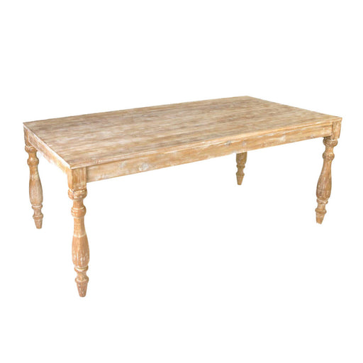 Angled view of rustic light brown wood dining table.