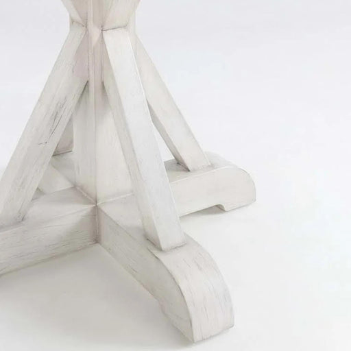 Classic white round wooden dining room table.